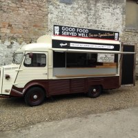 Vintage long wheel Citroen h vans. One is a coffee van and one a spicy chicken or veggie wrap can