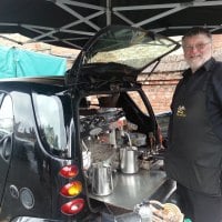 Bob serving delicious coffee! Mobile Coffee from the back of a Smart Car