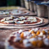 Making pizzas The Sunshine Pizza Oven