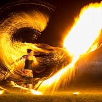 Kat Collett with her Fire Whip; see this for yourself in the 'Fire Show Extravaganza!' (Impressive fire photo with large fire ball)
