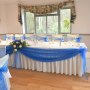 Top Table swag Ivory Stretch Chair Covers + Royal Blue Organza Sash