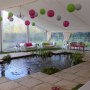 Wedding marquee built over a garden pond