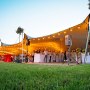 Full stretch tent structures in summer action for a private celebration Full stretch tent structures in summer action for a private celebration