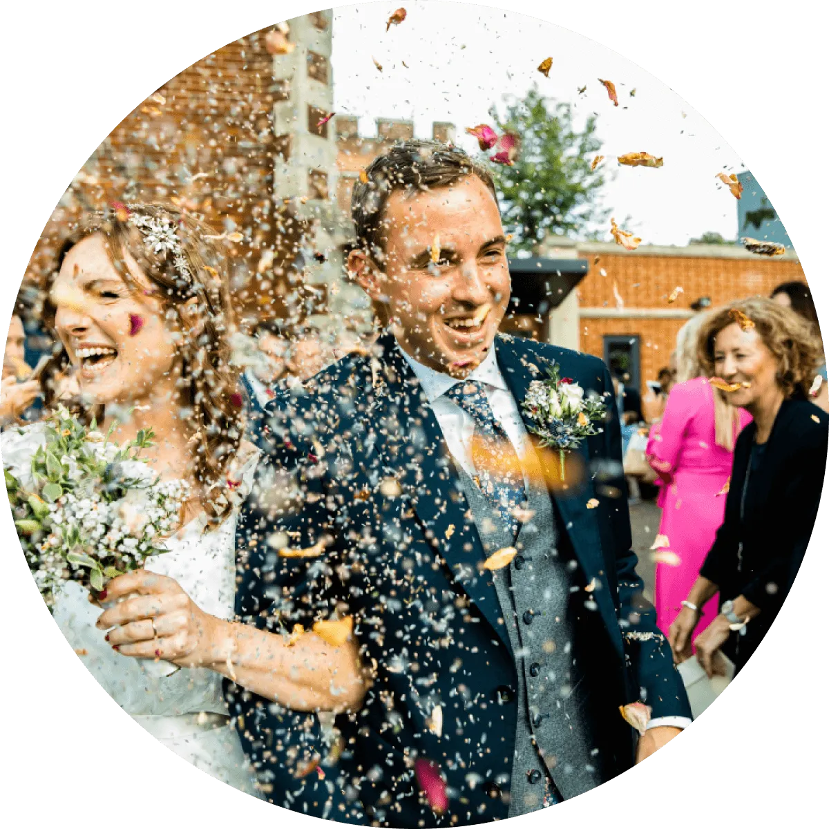 Image of wedding couple after ceremony with confetti. Image courtesy of Farlie Photography