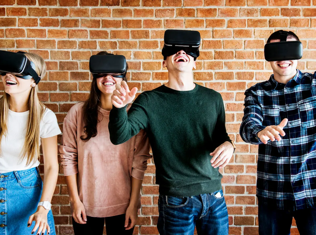 Four members wearing virtual reality headsets