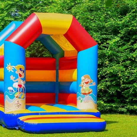 Image of a multi-coloured bouncy castle for children at a wedding