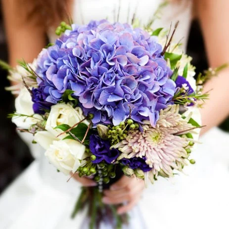 Up close image of a bouquet of purple flowers for a wedding