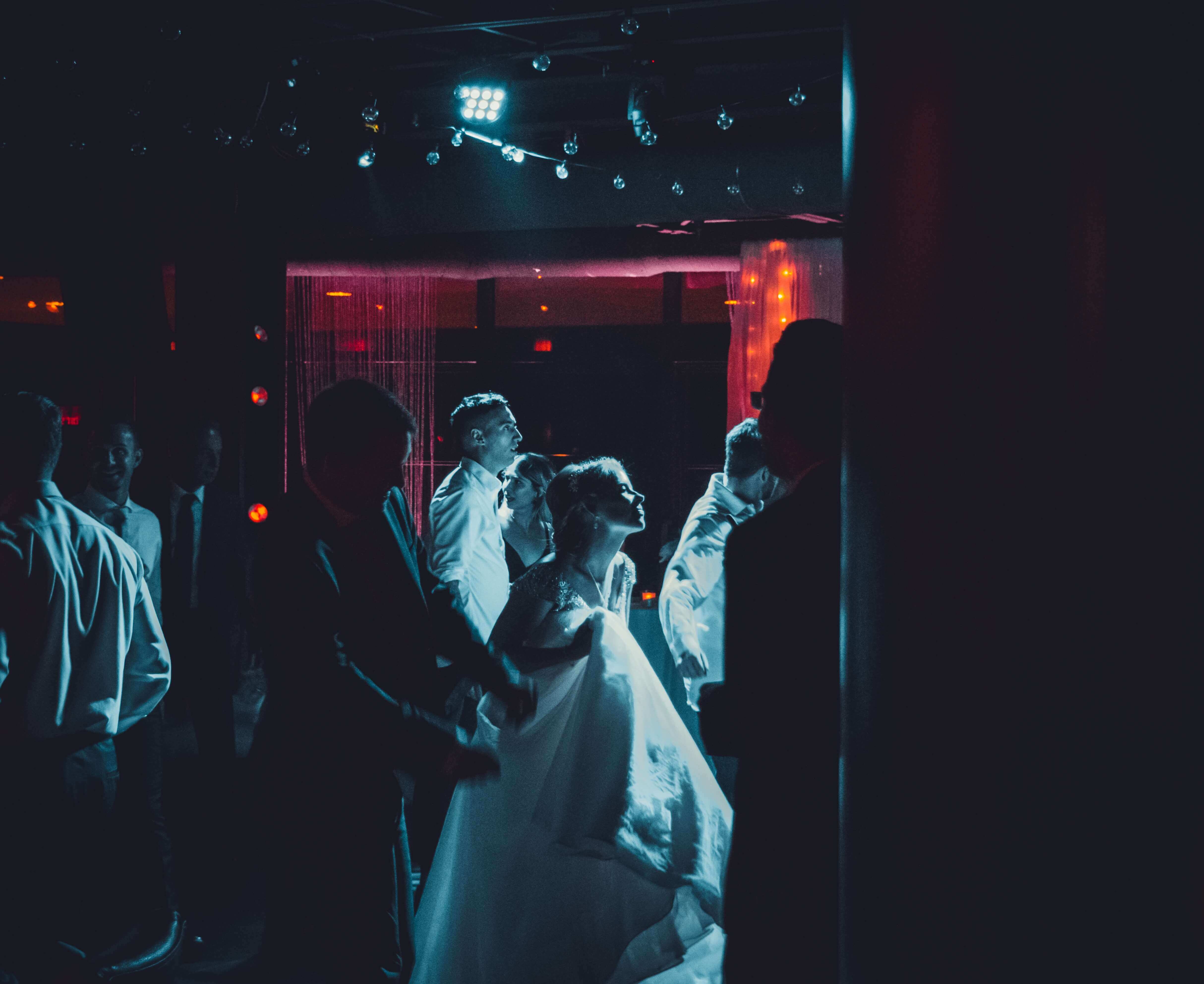 Newly-weds dancing at their reception party with a DJ