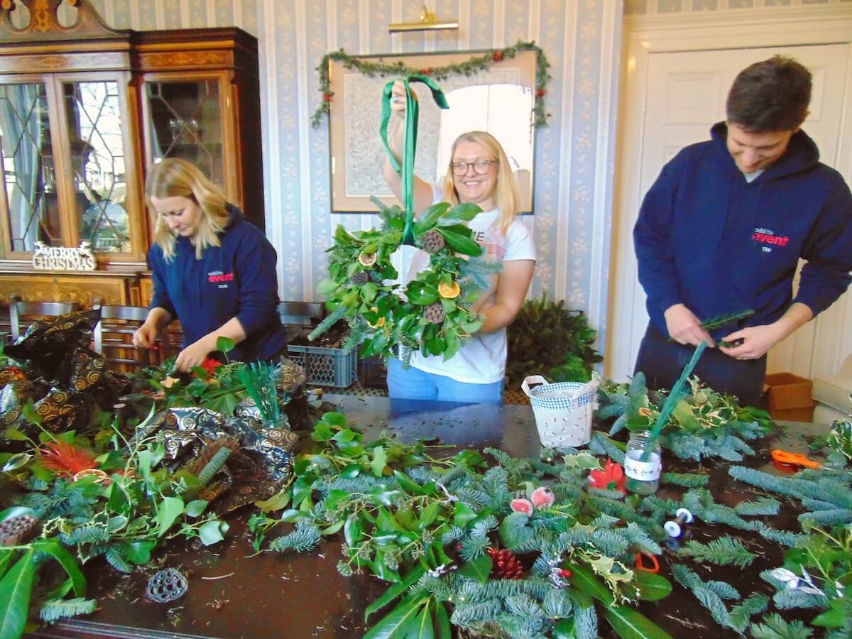 The team getting stuck in to the wreath-making workshop