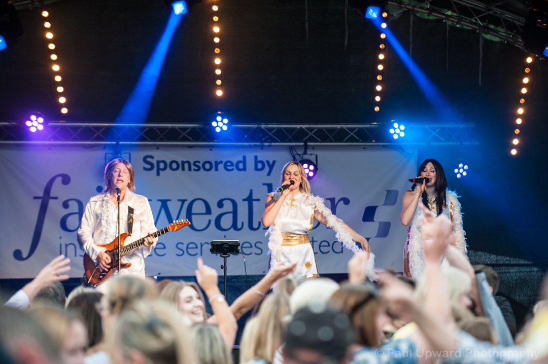 Live ABBA tribute band performing at a music event