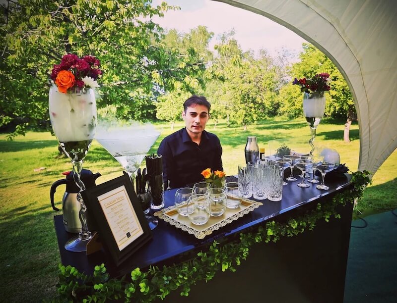 Cocktail Chemistry bartender ready to serve drinks at an event