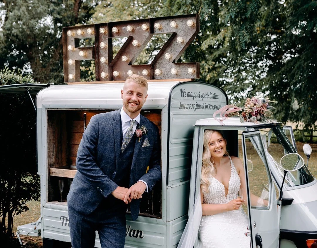 Newly Weds posing in and around the Fizz 76 Prosecco Van
