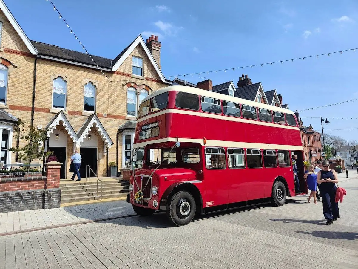 Vintage red bus hire for wedding guests