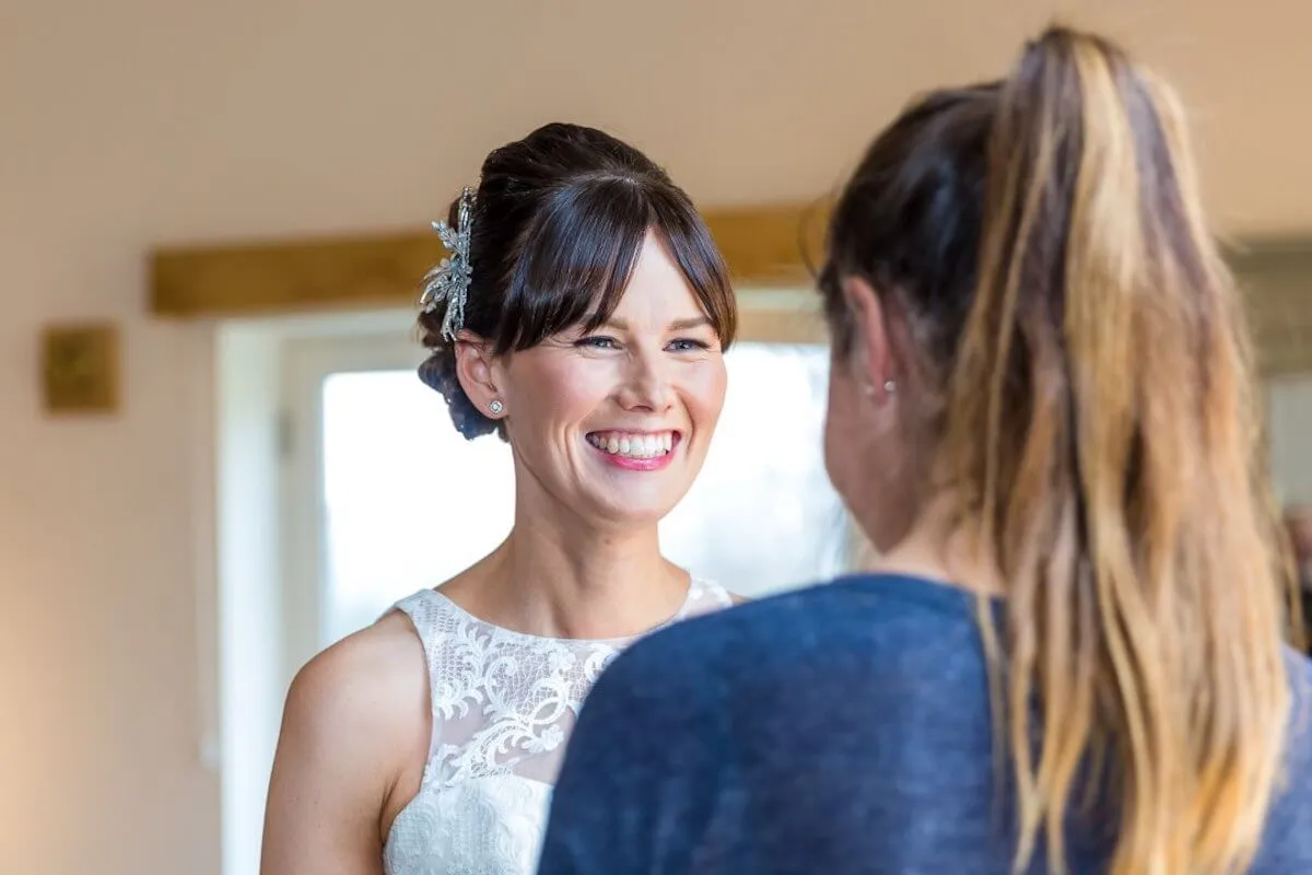 A bride getting her makeup done by Katie Morley for her big day