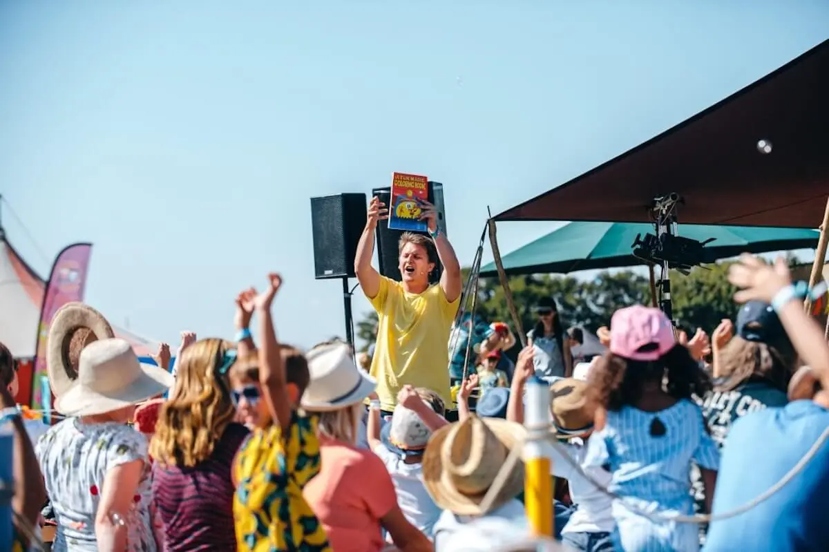 Non Stop Kids Entertainment performing to children at an outdoor festival