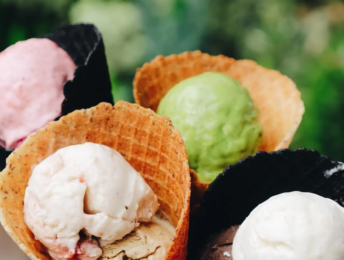 Up close image of colourful ice cream in light and dark wafers