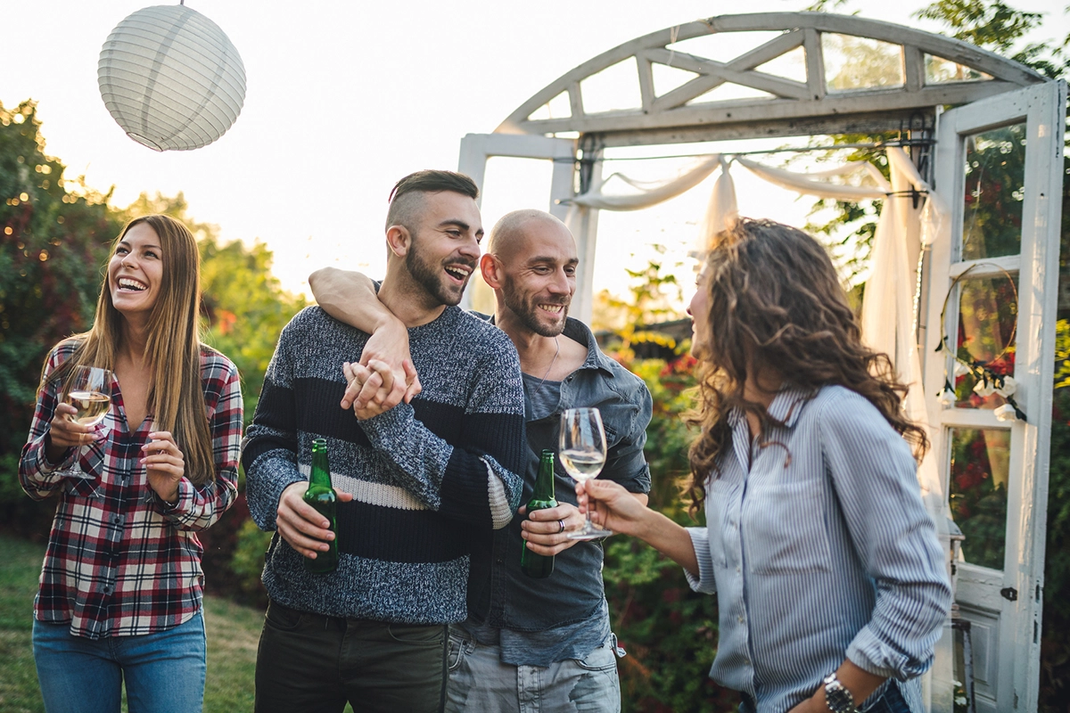 A homosexual couple celebrating their engagement at a party