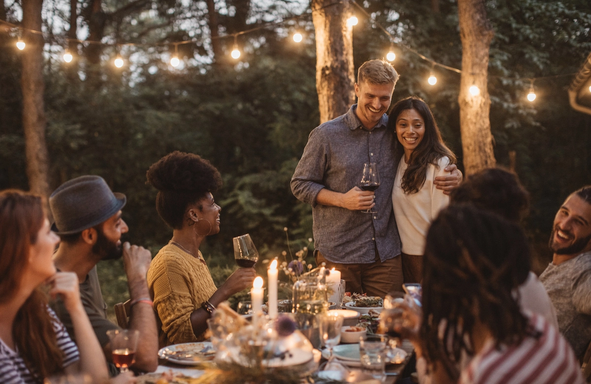 A group of young adults enjoying celebrations in an enchanted forest