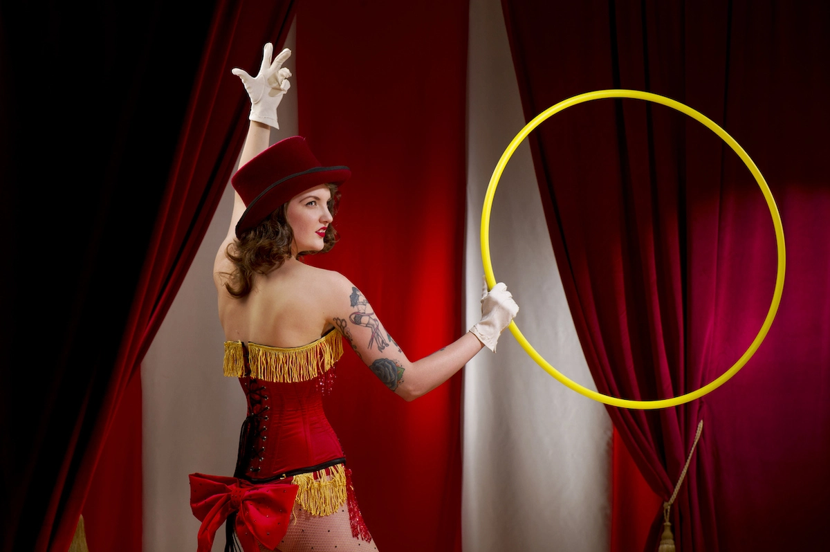 A woman performing dazzling tricks and acrobatics at a circus carnival